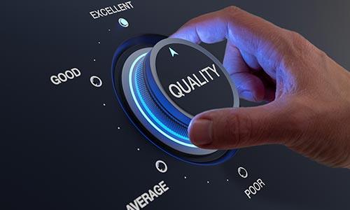 A photo of a hand turning a luminated dial with ‘Quality’ on it to the ‘Excellent’ option